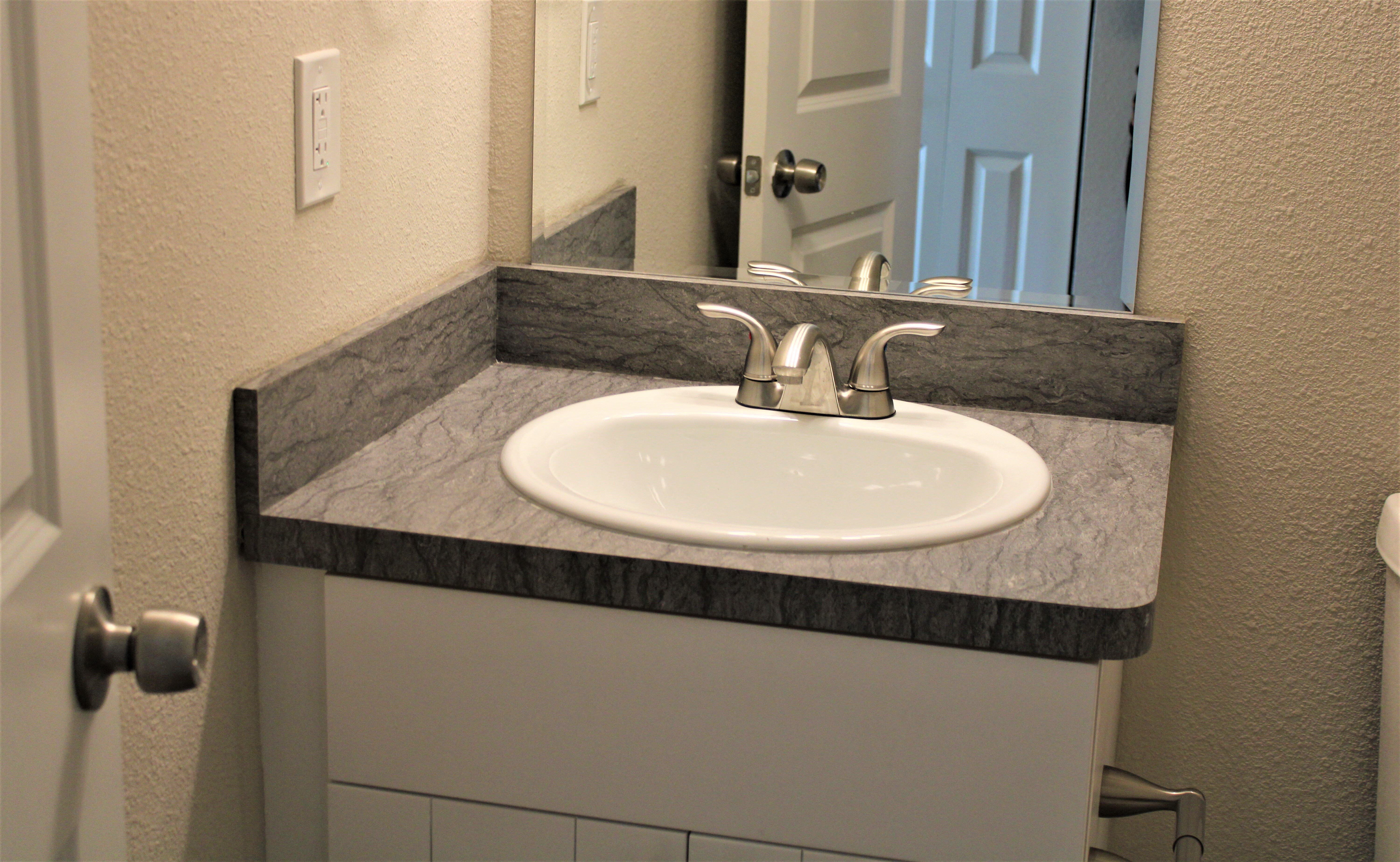 Manchester Ridge apartments in College Park, GA photo of outside of bathroom sink